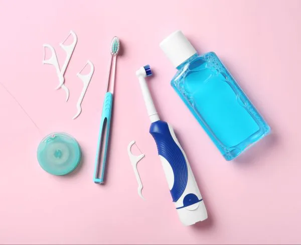 Toothbrush with floss and mouthwash from Grand Rapids dentists